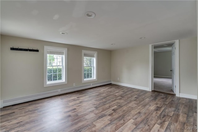 152 Leray St, Le Ray, NY 13612 - unfurnished room featuring wood finished floors, baseboards, a baseboard radiator, and recessed lighting