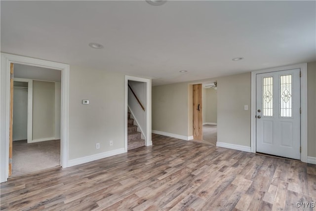 152 Leray St, Le Ray, NY 13612 - entryway featuring stairs, wood finished floors, and baseboards