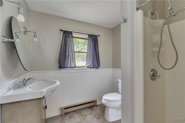152 Leray St, Le Ray, NY 13612 - full bathroom with a baseboard heating unit, a shower, a wainscoted wall, toilet, and vanity