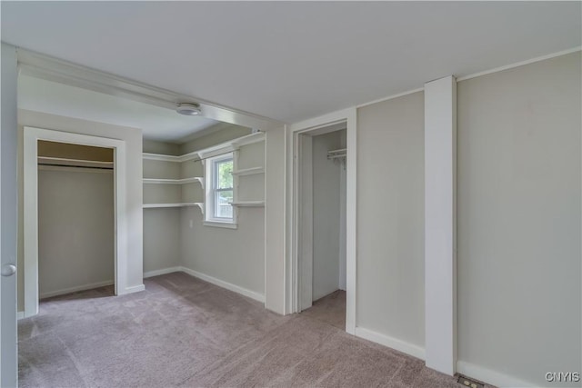152 Leray St, Le Ray, NY 13612 - unfurnished bedroom featuring carpet floors, multiple closets, and baseboards