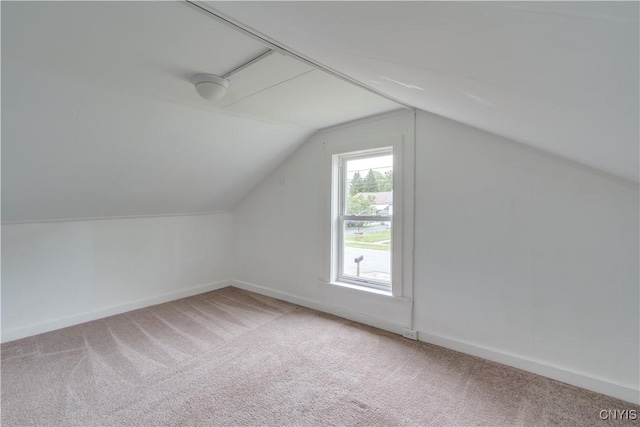 152 Leray St, Le Ray, NY 13612 - bonus room featuring light colored carpet, vaulted ceiling, and baseboards