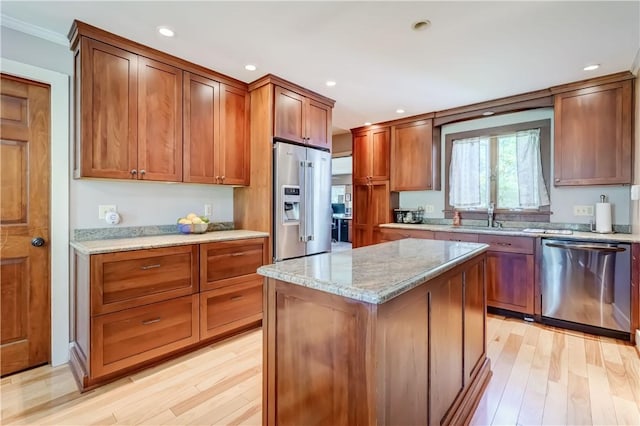 37 York St, Mendon, NY 14472 - kitchen with appliances with stainless steel finishes, a sink, light wood-type flooring, light stone countertops, and recessed lighting