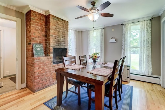 37 York St, Mendon, NY 14472 - dining room with light wood finished floors, baseboard heating, a ceiling fan, plenty of natural light, and ornamental molding