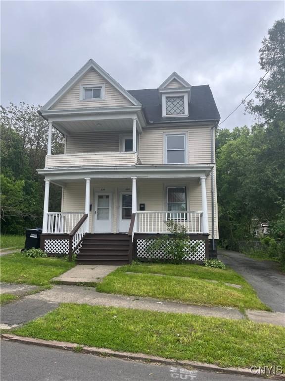 228-230 Elk St, Syracuse, NY 13205 - view of front of home with covered porch and a front yard