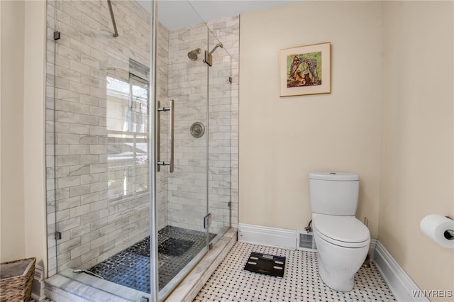 41 Irving Pl, Buffalo, NY 14201 - full bath with baseboards, a shower stall, tile patterned flooring, and toilet