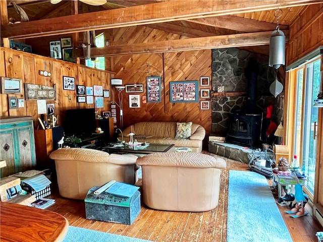 620 Ullas Way, Davenport, NY 13750 - living room featuring wooden walls, hardwood / wood-style flooring, a wood stove, and wood ceiling