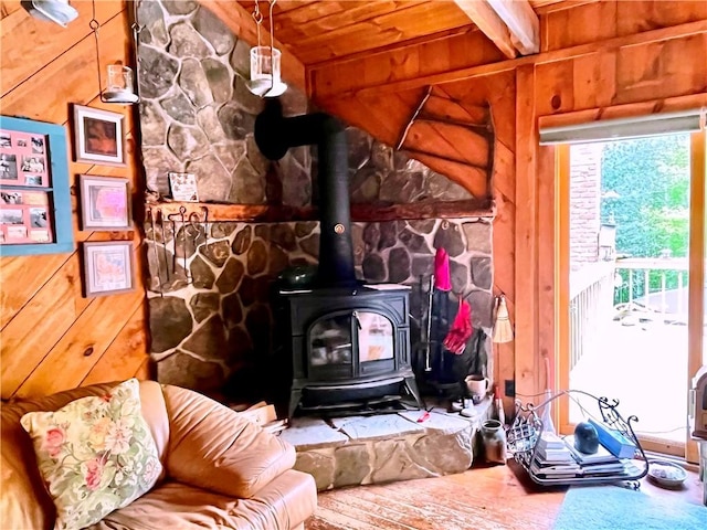 620 Ullas Way, Davenport, NY 13750 - living room with a wood stove, wood ceiling, wood walls, and hardwood / wood-style floors