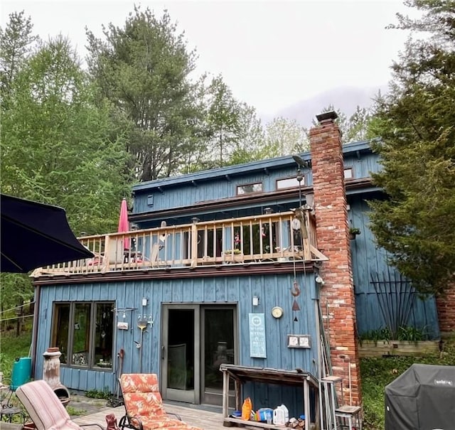 620 Ullas Way, Davenport, NY 13750 - rear view of house with a chimney and board and batten siding