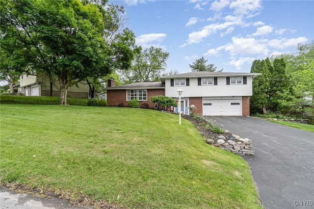 310 Wedgewood Ter, Dewitt, NY 13214 - tri-level home featuring brick siding, an attached garage, asphalt driveway, and a front lawn