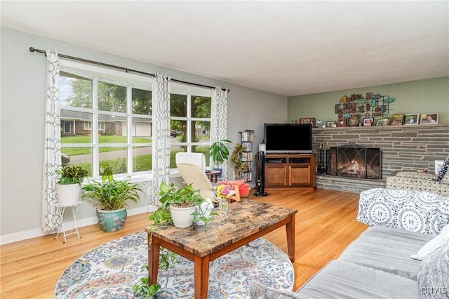 310 Wedgewood Ter, Dewitt, NY 13214 - living area with wood finished floors, a fireplace, and baseboards