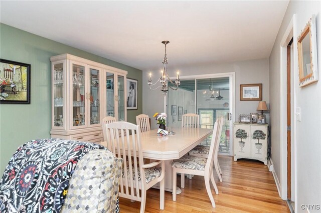 310 Wedgewood Ter, Dewitt, NY 13214 - dining room featuring a chandelier and light wood-style floors