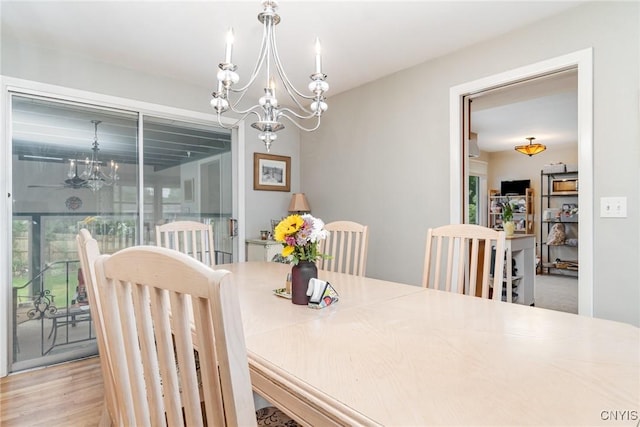 310 Wedgewood Ter, Dewitt, NY 13214 - dining area featuring a chandelier and wood finished floors