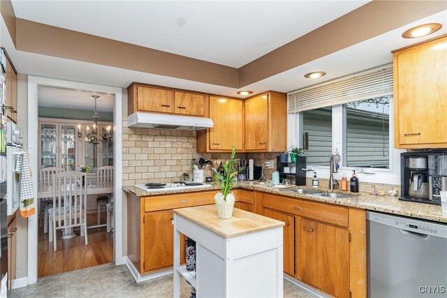 310 Wedgewood Ter, Dewitt, NY 13214 - kitchen with dishwasher, a sink, under cabinet range hood, white electric stovetop, and a chandelier