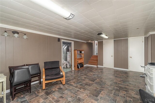 310 Wedgewood Ter, Dewitt, NY 13214 - living area featuring stairway, ornamental molding, wooden walls, and stone finish floors