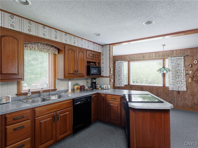 916 State St, Wilna, NY 13619 - kitchen featuring black appliances, a sink, a textured ceiling, light colored carpet, and brown cabinetry