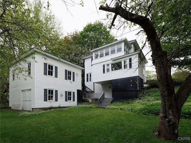 916 State St, Wilna, NY 13619 - rear view of property with a yard
