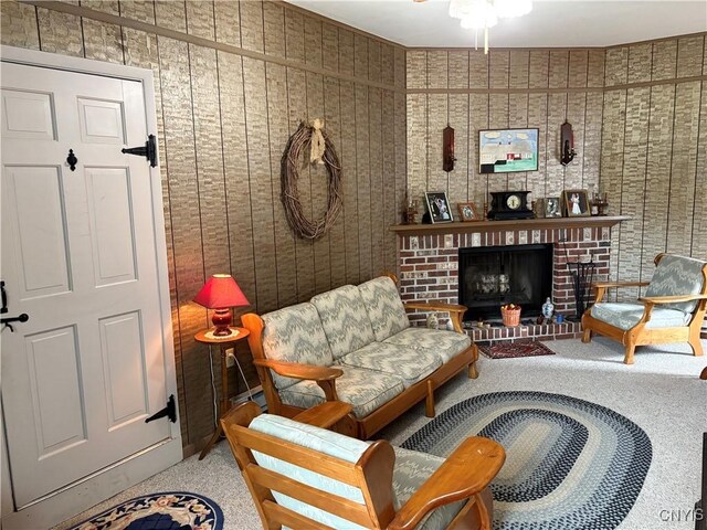 74 Eaton St, Hamilton, NY 13346 - carpeted living area featuring ceiling fan and a fireplace