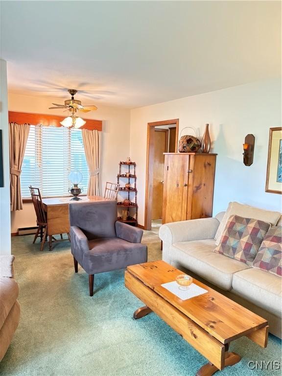 74 Eaton St, Hamilton, NY 13346 - living room featuring light colored carpet, a ceiling fan, and baseboard heating