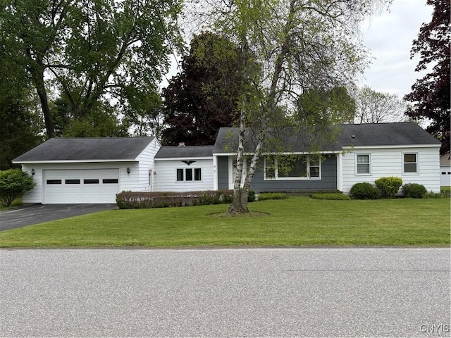 74 Eaton St, Hamilton, NY 13346 - single story home with driveway, an attached garage, and a front yard