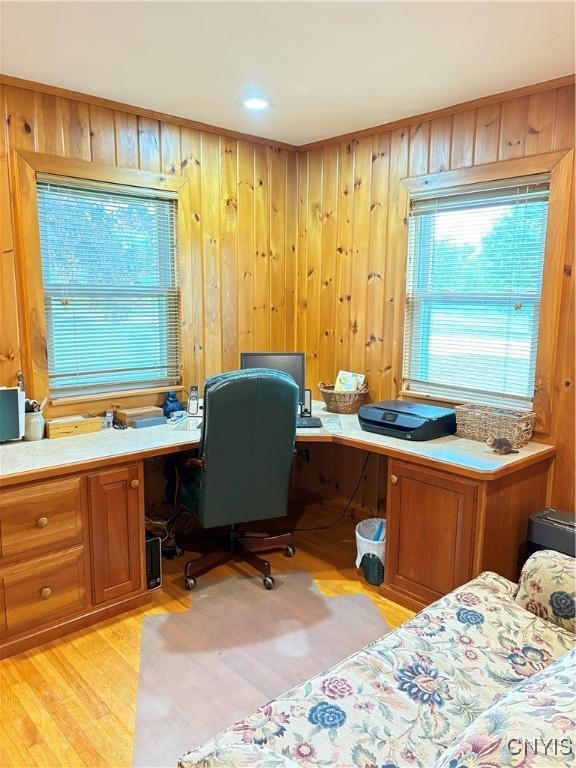 74 Eaton St, Hamilton, NY 13346 - office with built in desk, light wood-type flooring, healthy amount of natural light, and wood walls