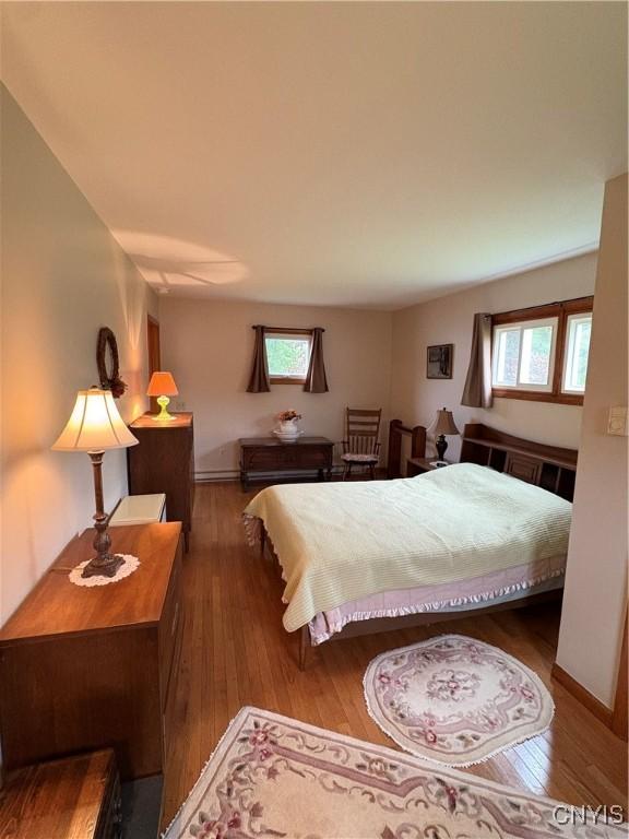74 Eaton St, Hamilton, NY 13346 - bedroom with hardwood / wood-style floors and baseboards
