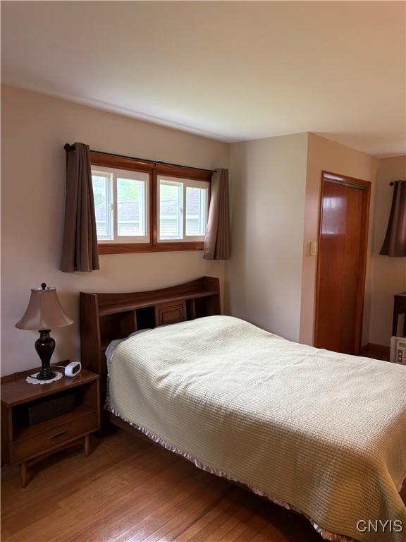 74 Eaton St, Hamilton, NY 13346 - bedroom featuring wood finished floors