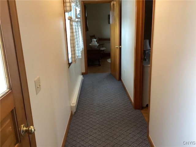 74 Eaton St, Hamilton, NY 13346 - corridor with a baseboard heating unit, light carpet, and baseboards