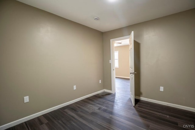 2707 State Route 48, Minetto, NY 13115 - empty room with dark wood-type flooring, baseboards, and a smoke detector
