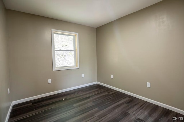 2707 State Route 48, Minetto, NY 13115 - spare room with dark wood-type flooring and baseboards