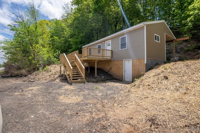 2707 State Route 48, Minetto, NY 13115 - rear view of house with stairs and a wooden deck