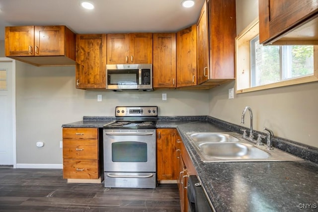 2707 State Route 48, Minetto, NY 13115 - kitchen with appliances with stainless steel finishes, a sink, brown cabinets, recessed lighting, and dark countertops