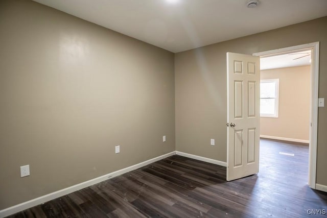 2707 State Route 48, Minetto, NY 13115 - spare room featuring baseboards, dark wood-style flooring, and a smoke detector