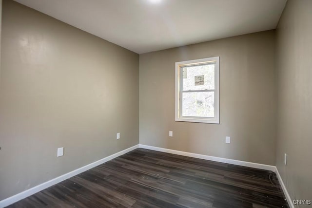 2707 State Route 48, Minetto, NY 13115 - spare room featuring baseboards and dark wood-style flooring