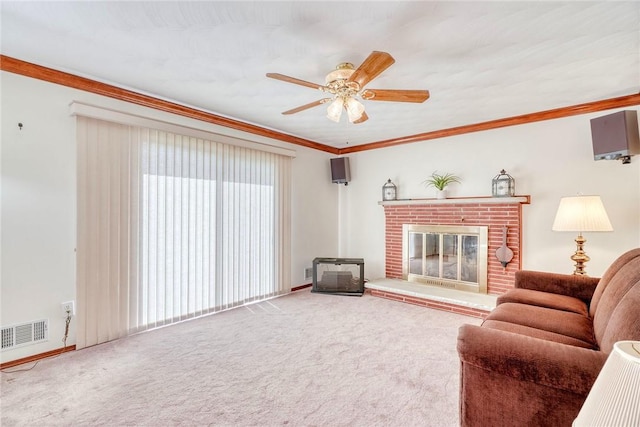 173 Dorian Ln, Greece, NY 14626 - carpeted living room featuring a ceiling fan, a fireplace, crown molding, and baseboards