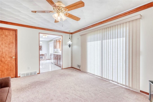 173 Dorian Ln, Greece, NY 14626 - unfurnished living room with ceiling fan, light colored carpet, baseboards, and ornamental molding