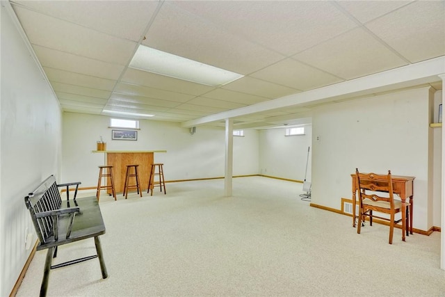 173 Dorian Ln, Greece, NY 14626 - sitting room featuring a dry bar, a drop ceiling, carpet, baseboards, and plenty of natural light