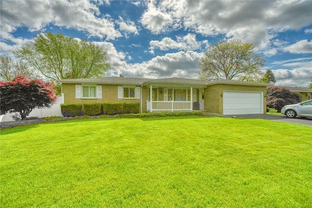 173 Dorian Ln, Greece, NY 14626 - ranch-style house featuring a porch, asphalt driveway, an attached garage, and a front lawn