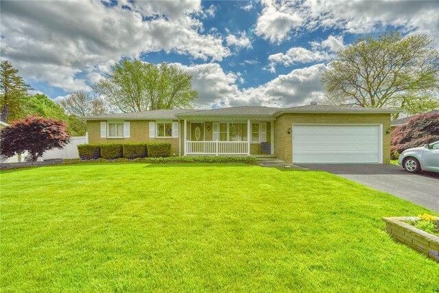 173 Dorian Ln, Greece, NY 14626 - ranch-style house featuring a porch, asphalt driveway, an attached garage, and a front yard