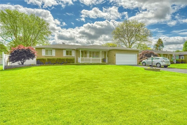 173 Dorian Ln, Greece, NY 14626 - ranch-style house featuring asphalt driveway, a porch, an attached garage, and a front yard