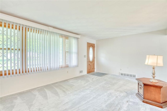 173 Dorian Ln, Greece, NY 14626 - carpeted foyer entrance featuring plenty of natural light