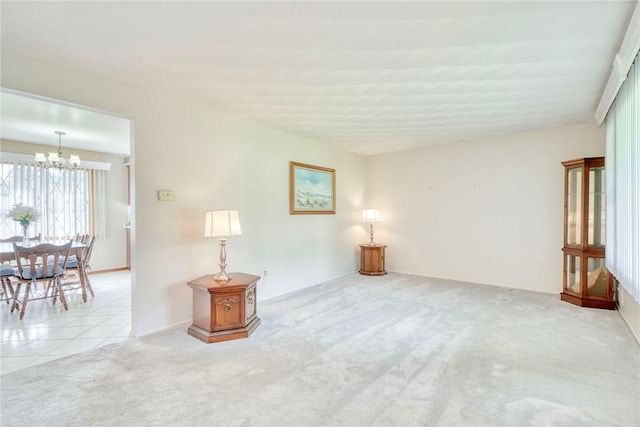 173 Dorian Ln, Greece, NY 14626 - carpeted spare room featuring a chandelier and tile patterned flooring