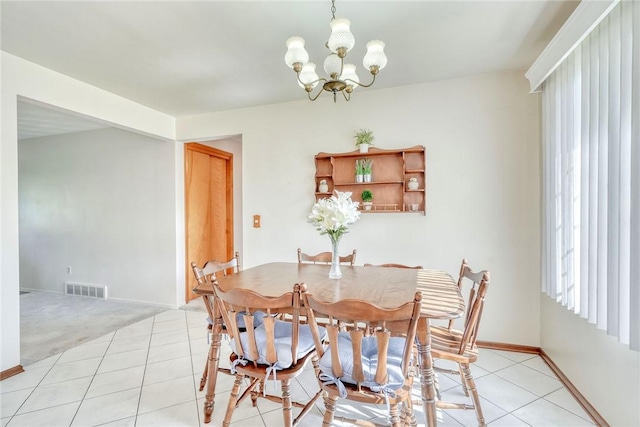 173 Dorian Ln, Greece, NY 14626 - dining room with a chandelier, baseboards, and light tile patterned floors