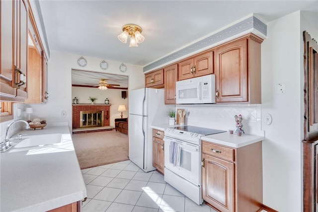173 Dorian Ln, Greece, NY 14626 - kitchen featuring white appliances, a sink, light countertops, light colored carpet, and ceiling fan