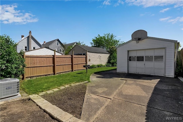 84 Newfield St, Buffalo, NY 14207 - view of yard with an outbuilding, cooling unit, a detached garage, and concrete driveway