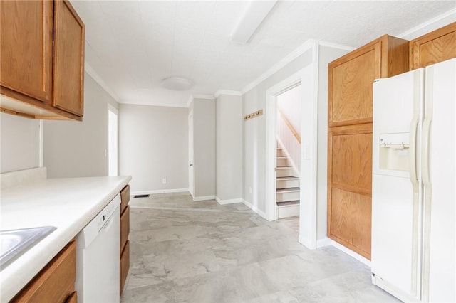 1184 Osband Ave, Macedon, NY 14502 - kitchen with white appliances, crown molding, light countertops, brown cabinets, and a sink