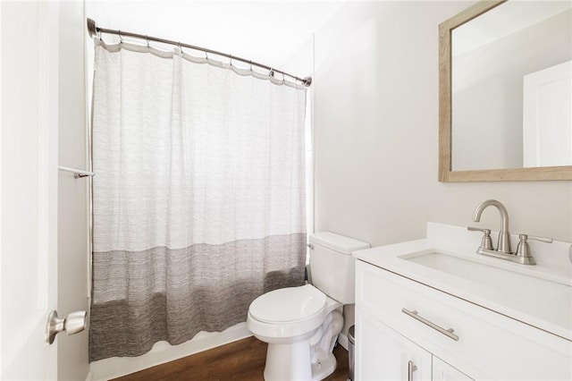 1184 Osband Ave, Macedon, NY 14502 - full bath with toilet, shower / bath combo with shower curtain, vanity, and wood finished floors