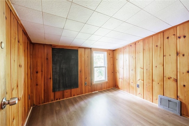 1184 Osband Ave, Macedon, NY 14502 - unfurnished room featuring wood finished floors and wooden walls