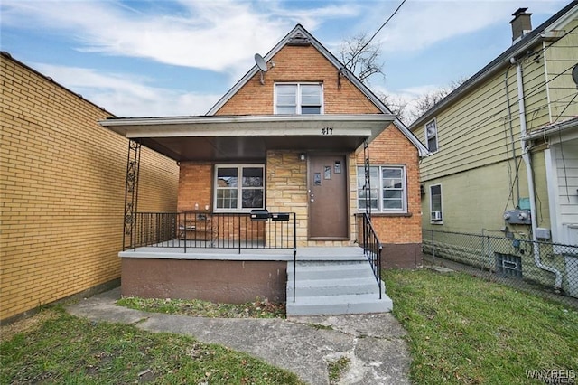 417 24th St, Niagara Falls, NY 14303 - view of front of home featuring covered porch and brick siding