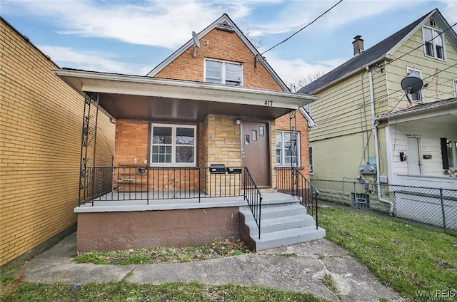 417 24th St, Niagara Falls, NY 14303 - view of front of house featuring covered porch and brick siding
