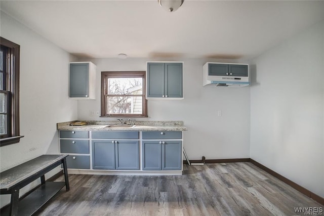 417 24th St, Niagara Falls, NY 14303 - kitchen with dark wood-style floors, light countertops, a sink, and baseboards
